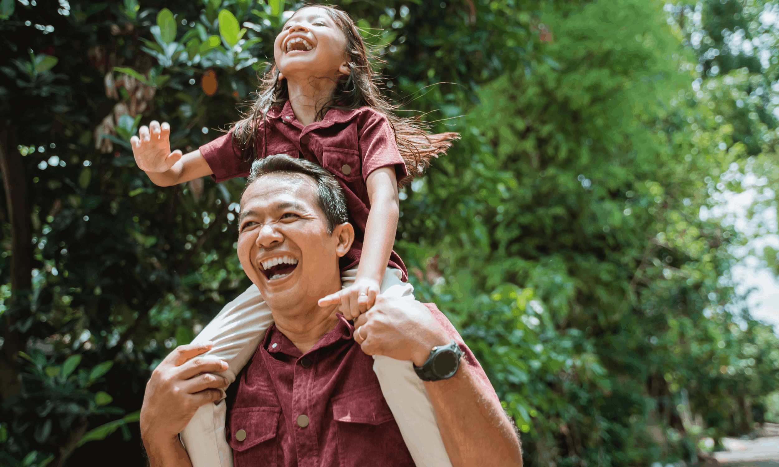 man and daughter laughing